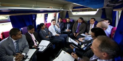 Virtual tour of Japan Trip. Participants on a bus discussing the tour.